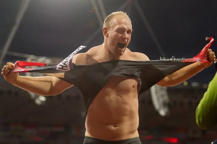 athlete-ripping-shirt-celebration-stadium