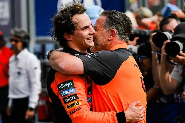 f1-celebration-driver-hugging-team-member