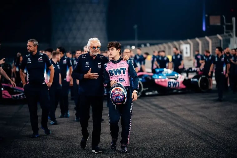 f1-driver-team-discussion-race-track