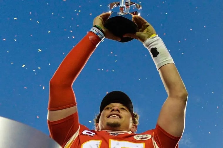 football-player-holding-trophy-celebration