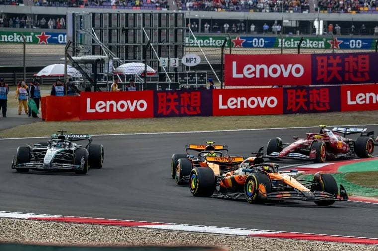 formula-1-race-cars-turning-track