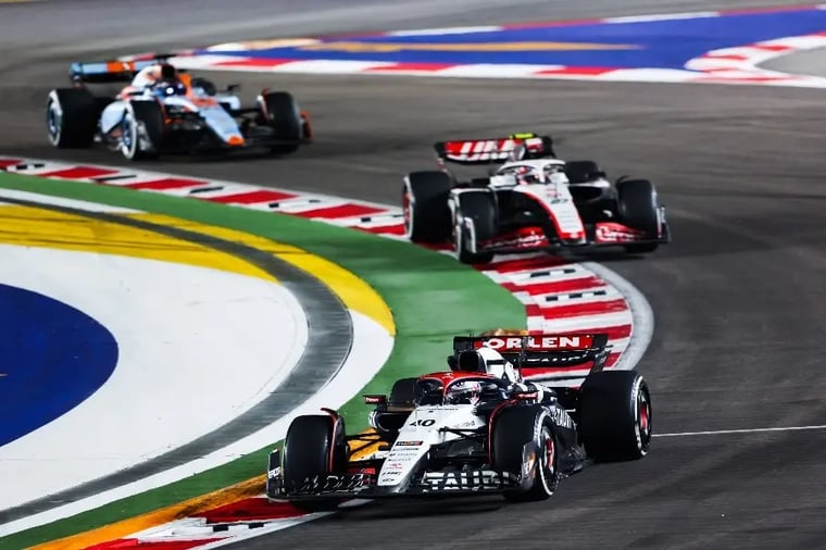 formula-one-race-cars-on-track-turn