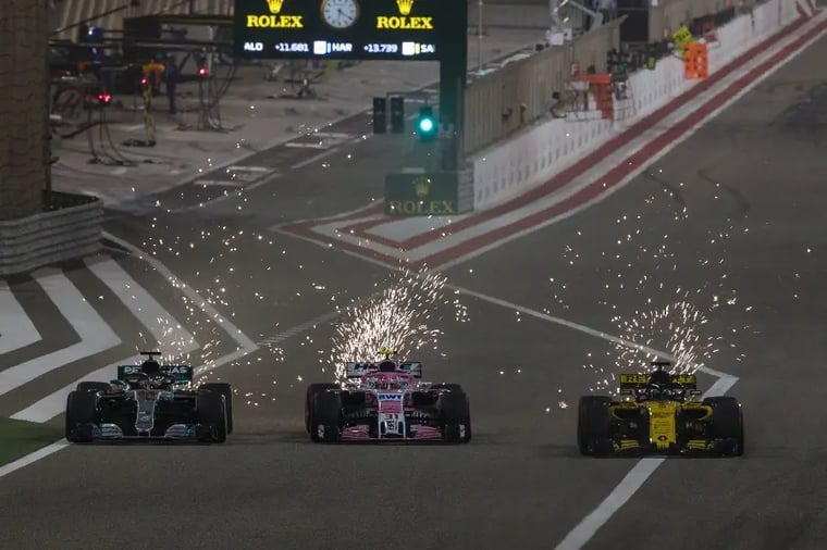 formula1-race-cars-sparks-night-track