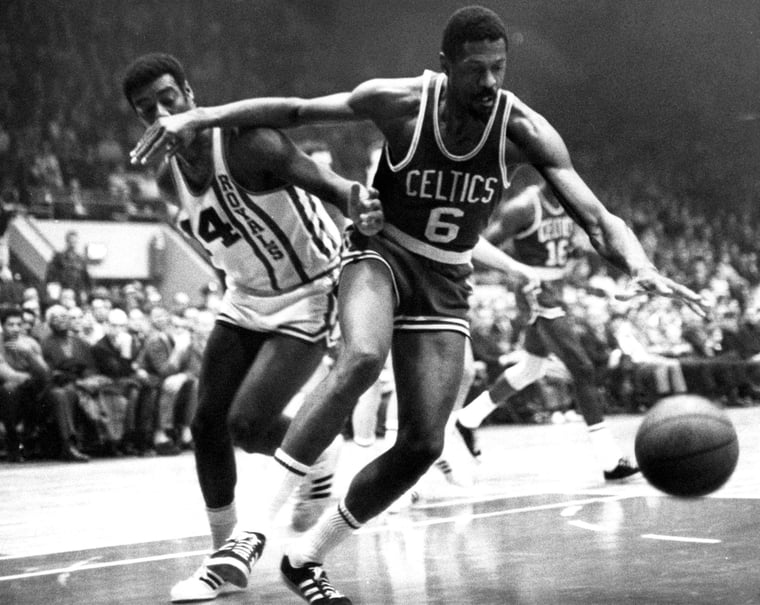 Bill Russell dribbles past Oscar Robertson 1965