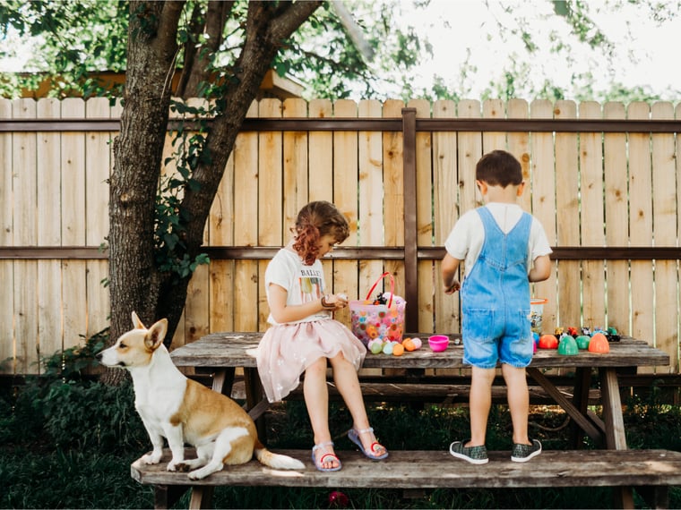 Two kids decorating easter eggs