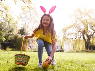 girl collecting easter eggs image