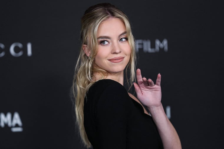 IMAGO / ABACAPRESS / Collin Xavier |  Sydney Sweeney wearing a Saint Laurent dress arrives at the 10th Annual LACMA Art + Film Gala. 