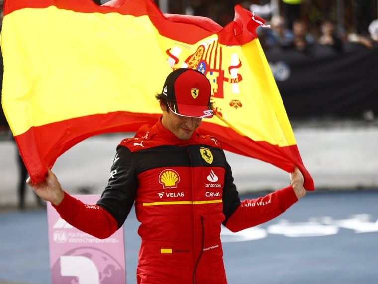 Carlos Sainz Ferrari 1st position celebrates with a Spanish flag