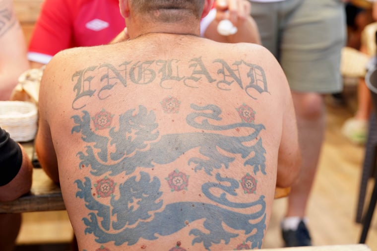man with three lions tattoo