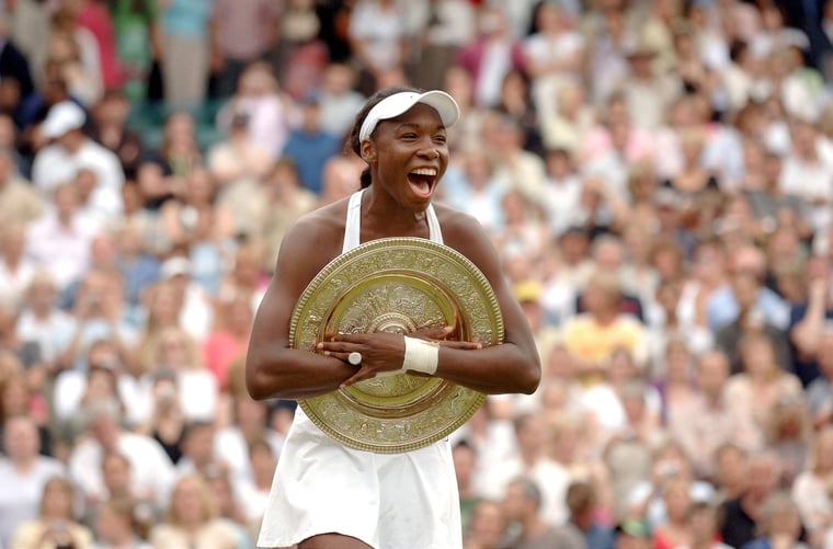 US tennis player Venus Williams defeats US player Lindsay Davenport, 4-6, 7-6, 9-7, at the Wimbledon Tennis Tournament finale, in London, UK