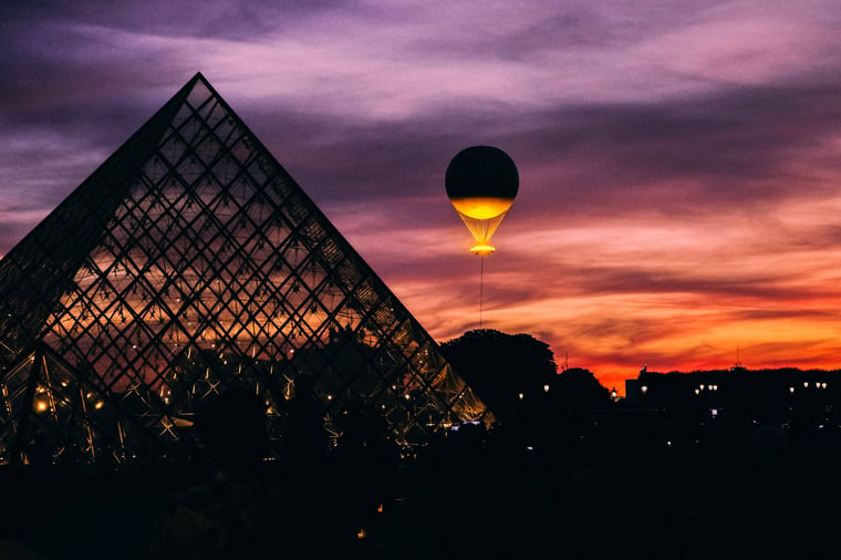 Olympic cauldron Louvre Paris 2024 sunset