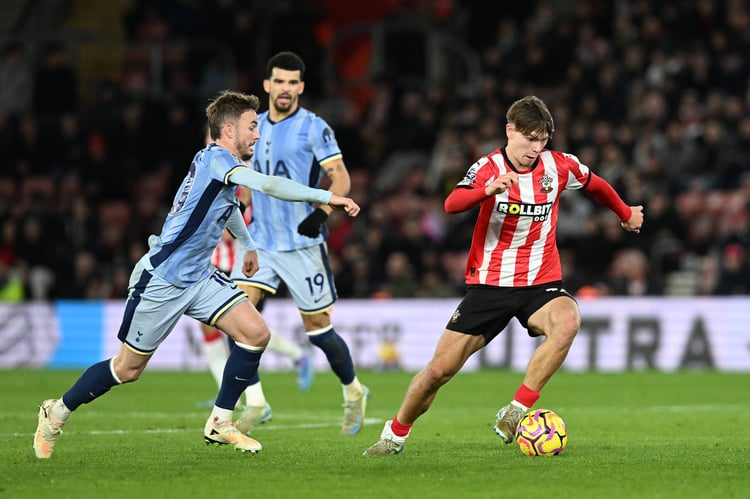 Photo of Tyler Dibling battling for the ball with James Maddison from Tottenham Hotspurs.