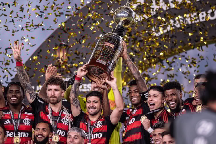 Lima, Peru: Giorgian de Arrascaeta and Bruno Henrique of Flamengo lift the Champion s trophy after winning the Copa CONMEBOL Libertadores 2025 final match between Palmeiras and Flamengo, November 29, 2025
