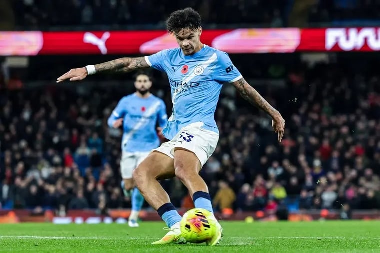 manchester-city-soccer-player-kicking-ball