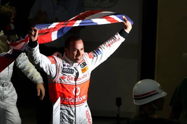 race-car-driver-celebrates-victory-flag