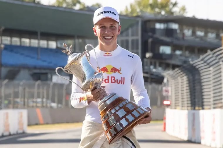 race-car-driver-holding-trophy-victory (2)
