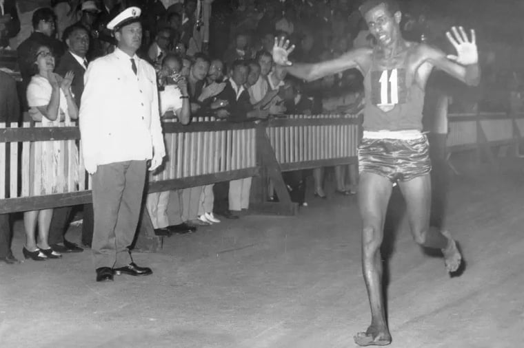 runner-barefoot-victory-race-crowd-celebration