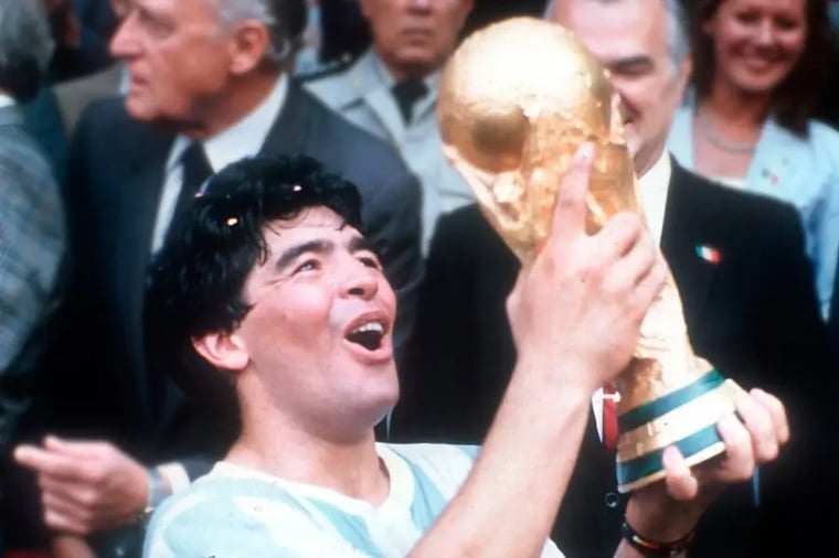 soccer-player-holding-world-cup-trophy-celebration 