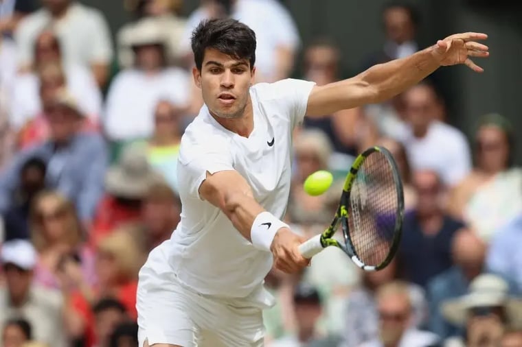 tennis-player-hitting-ball-wimbledon-match