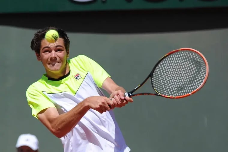 tennis-player-hitting-forehand-shot-court