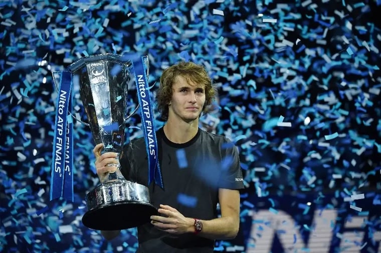 tennis-player-holding-atp-finals-trophy