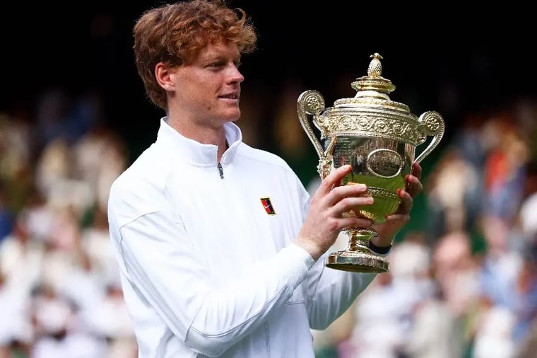 tennis-player-holding-trophy-victory-celebration (1)