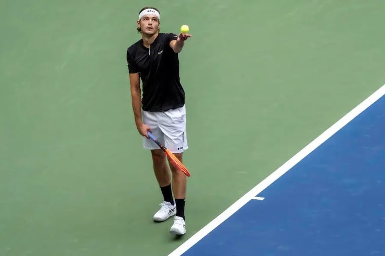 tennis-player-serving-action-shot-court