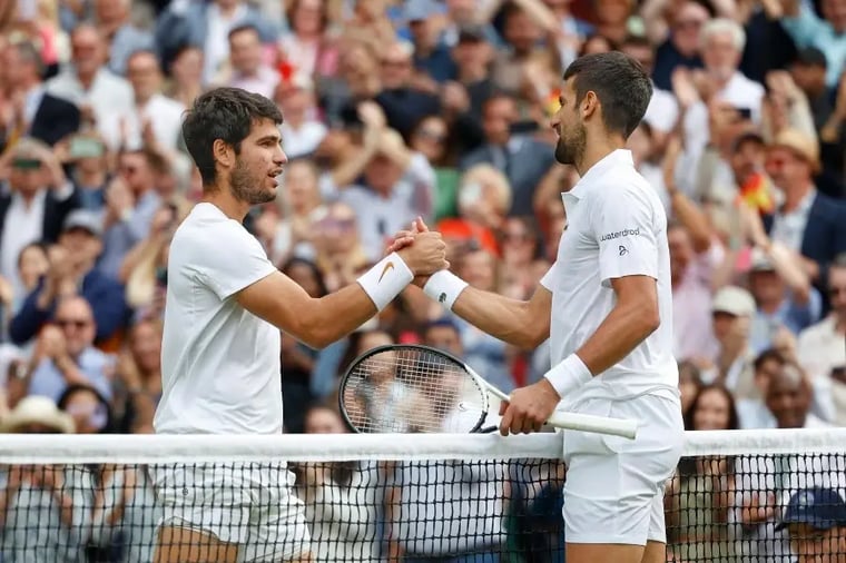 tennis-players-handshake-court-crowd