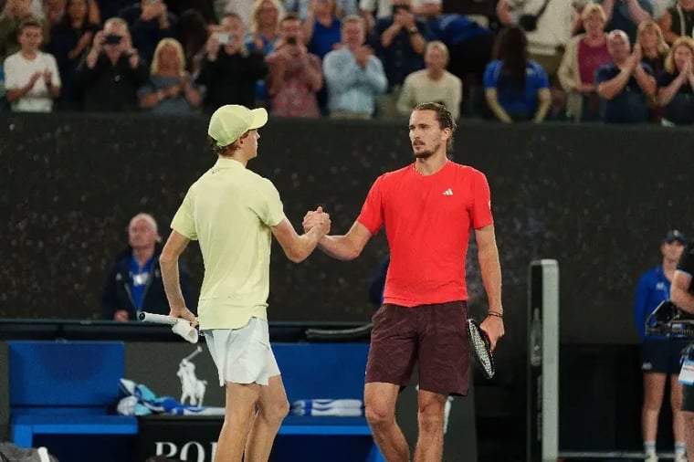 tennis-players-handshake-match-crowd