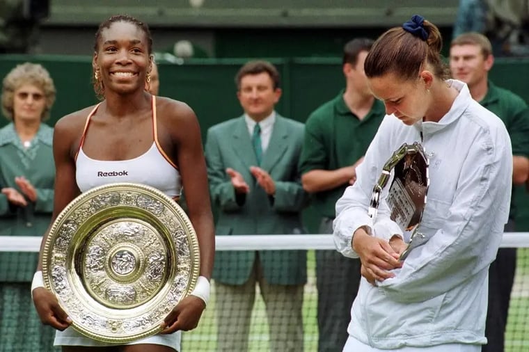 wimbledon-tennis-champion-holding-trophy