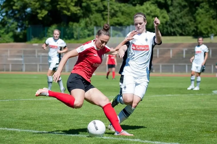 women-soccer-match-action-shot-field