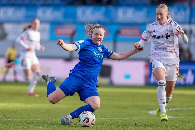 women-soccer-match-action-tackle-field (1)