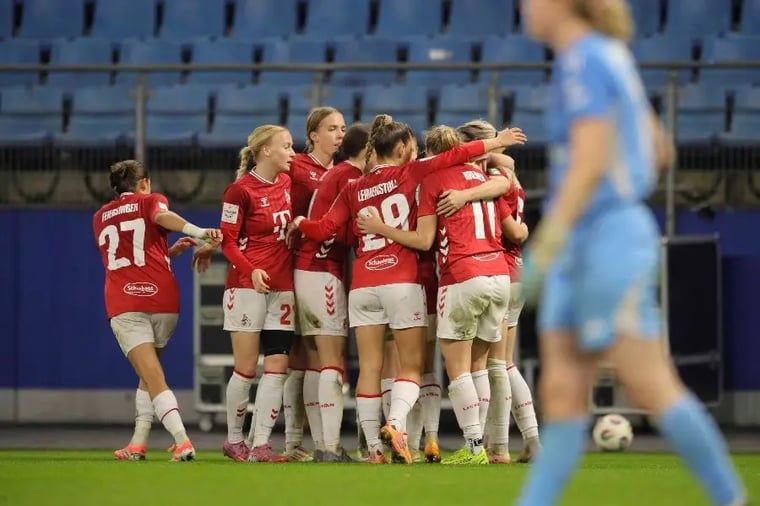 women-soccer-team-celebrating-goal