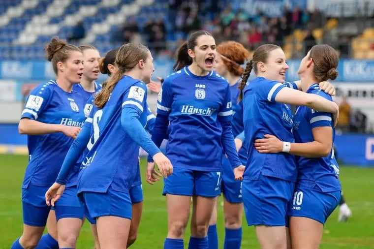 women-soccer-team-celebrating-victory-game